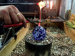 Stretching and Forming Molten Glass
